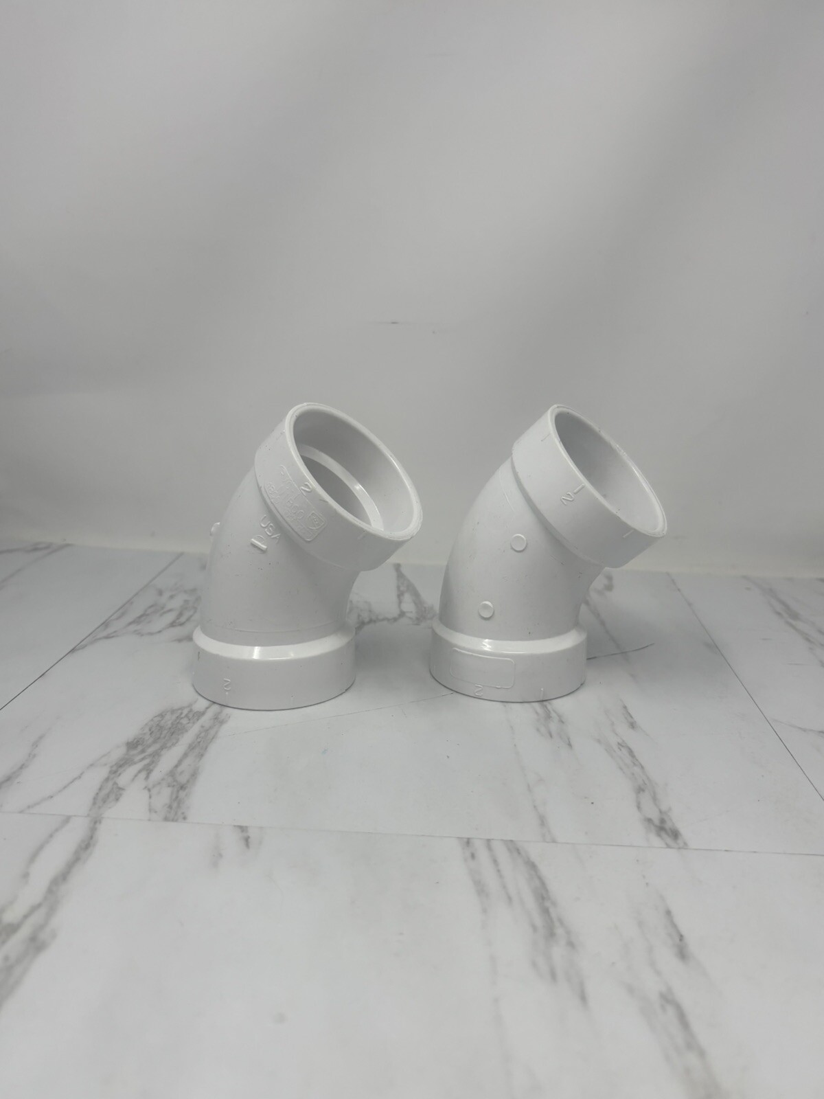 LOT OF 2 – NIBCO 2 in. PVC 45-Degree Hub x Hub Elbow Pipe Fittings C4808HD2