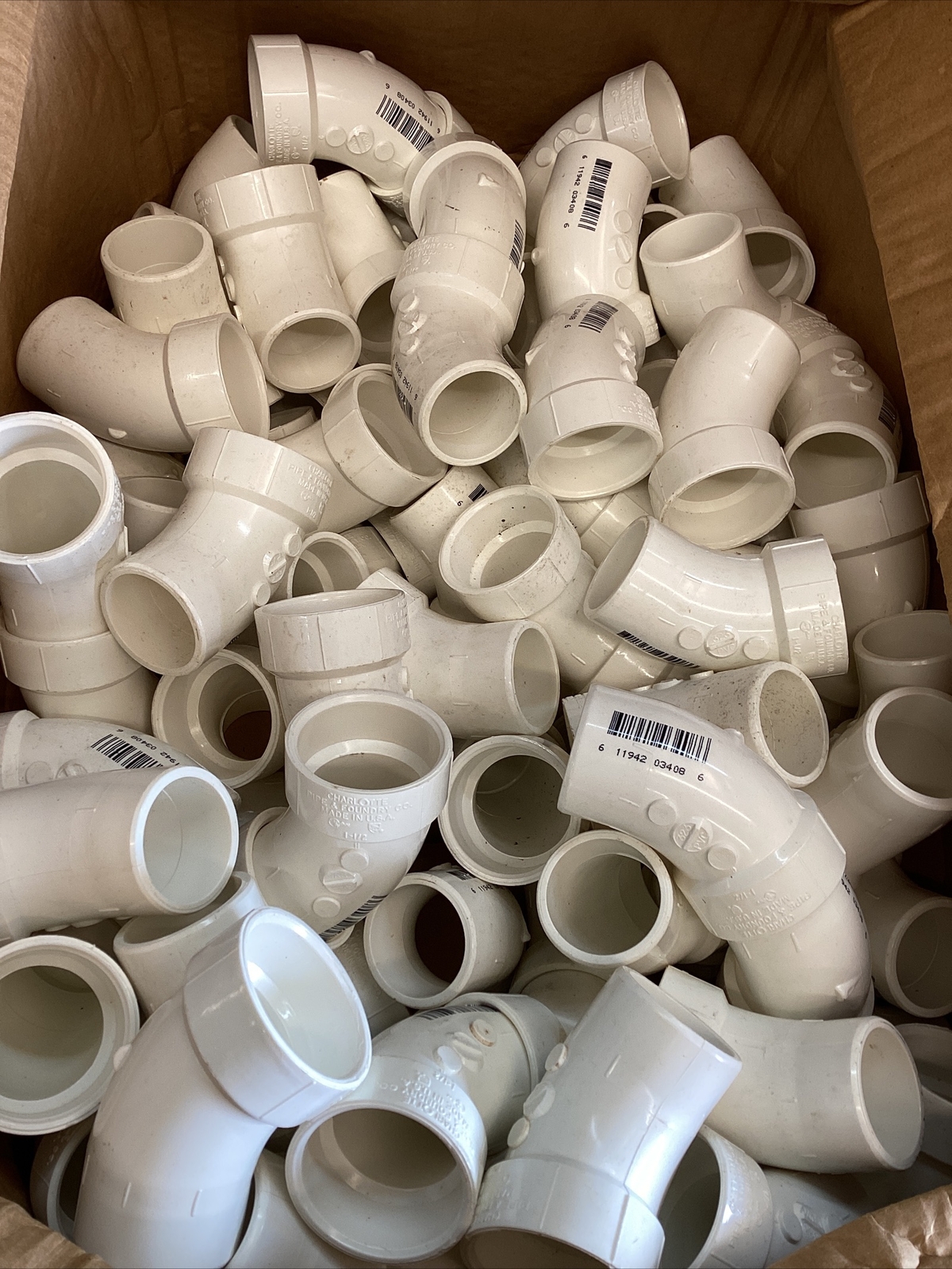 75+White 1-1/2” Charlotte #323 PVC DWV 1/8” Bent Street Elbow SPG x Hub