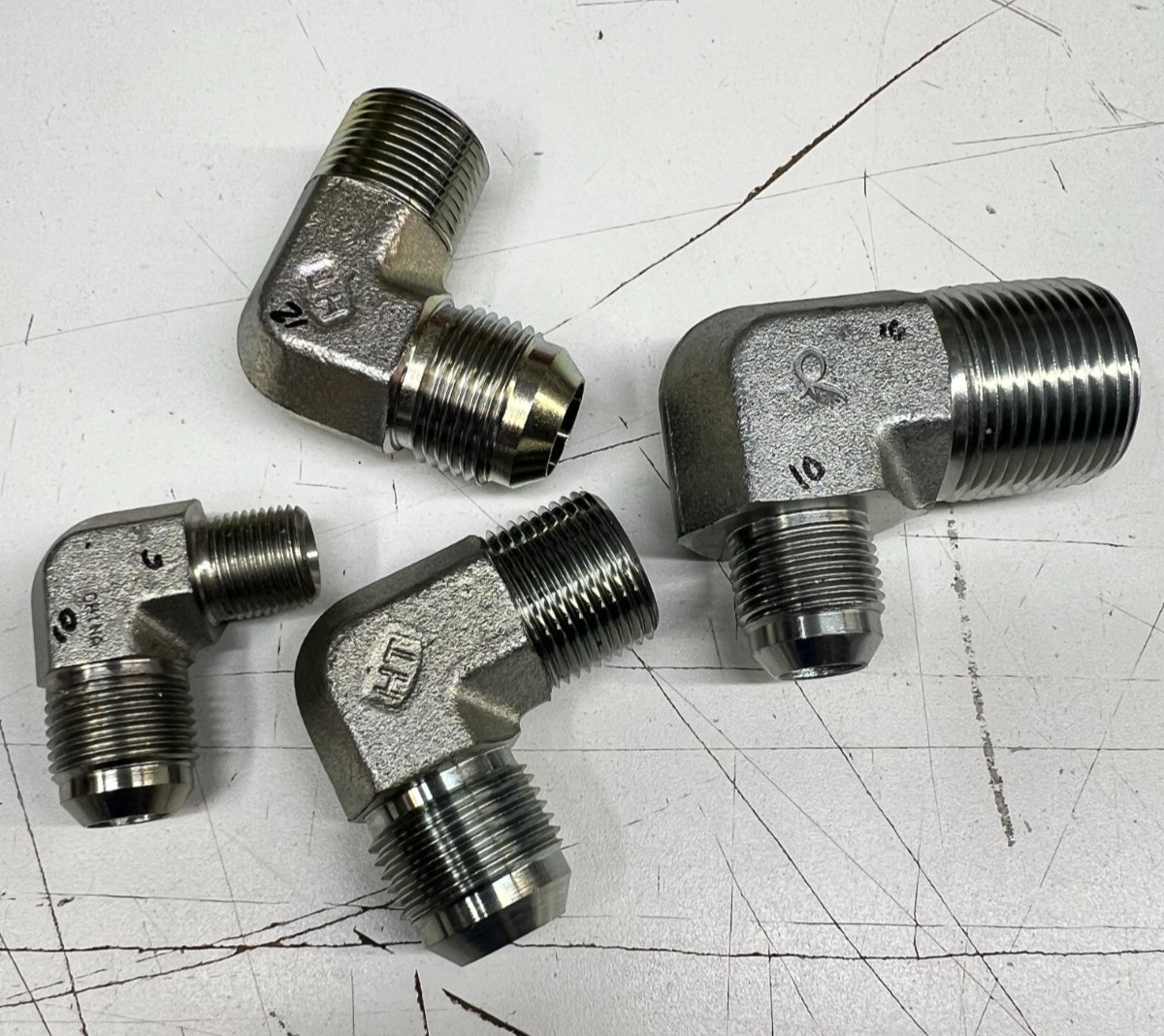 Various Sizes of 2501-FG 90 Degree Elbow Male 37° Flare JIC x NPT Threaded Steel