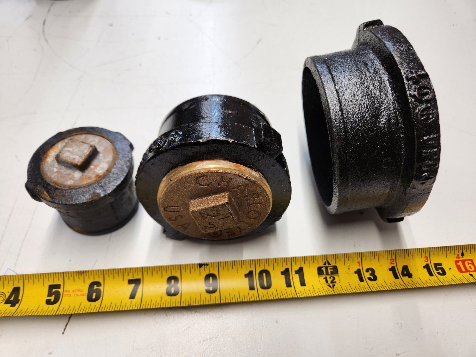 Various Sizes of Charlotte NH52 Tapped Ferrule No-Hub Cast Iron Raise Head Brass