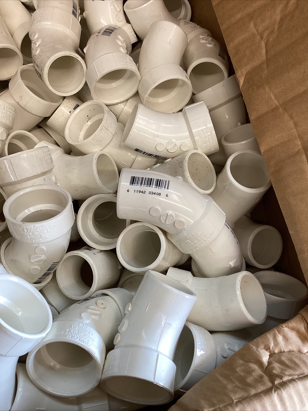 75+White 1-1/2” Charlotte #323 PVC DWV 1/8” Bent Street Elbow SPG x Hub